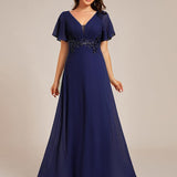 Robe de soirée longue à col en V et appliques à la taille grande taille