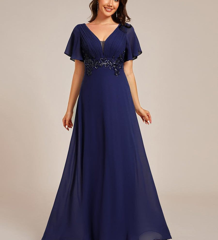 Robe de soirée longue à col en V et appliques à la taille grande taille