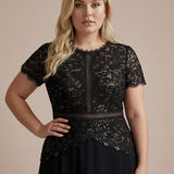 Robe longue à encolure ronde à manches courtes en sequins coupe évasée
