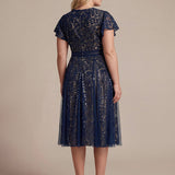 Robe midi évasée en tulle avec manches courtes décolleté en V et volants